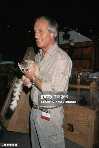 American zookeeper Jack Hanna holding a lemur attends the 36th Annual National Association of Television Program Executives Convention and...