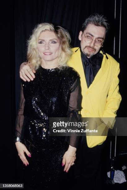 American singer, songwriter and actress Debbie Harry, wearing a black outfit with tulle sleeves, and American guitarist and songwriter Chris Stein,...