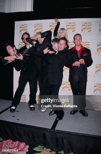 American pop punk band Lit with American actress Christina Aguilera attend the 2000 ASCAP Pop Music Awards, held at the Beverly Hilton Hotel, in...