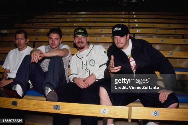 American hip hop band House of Pain sitting on bleachers, circa 1993. The man sitting to the left of the frame is.