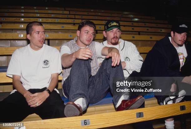 American hip hop band House of Pain sitting on bleachers, circa 1993. The man sitting to the left of the frame is.