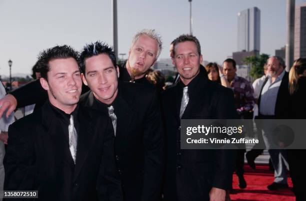 American pop punk band Lit attend the Los Angeles premiere of 'Titan AE', held at the Staples Center in Los Angeles, California, 13th June 2000.