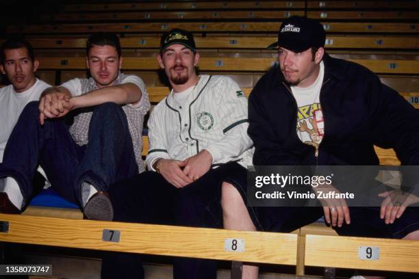 American hip hop band House of Pain sitting on bleachers, circa 1993. The man sitting to the left of the frame is.