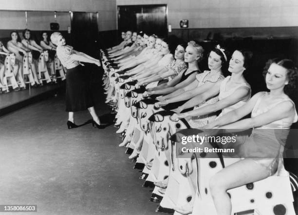 Artistic Director and choreographer Florence Rogge puts the Rockettes through a routine backstage at Radio City Music Hall, New York, 1947.