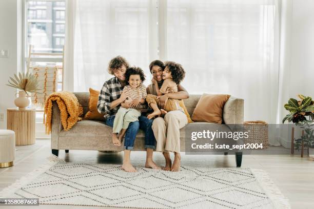 saving for child's education - family with two children stock pictures, royalty-free photos & images