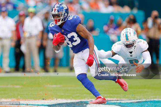 Pharoh Cooper of the New York Giants breaks a tackle from Noah Igbinoghene of the Miami Dolphins during the first quarter at Hard Rock Stadium on...