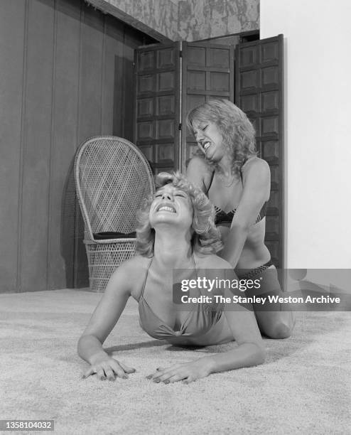 Apartment House Wrestling, Wendy vs. Giselle. Photo shows Giselle pulling Wendy's head back during their wrestling match in Los Angeles, California...