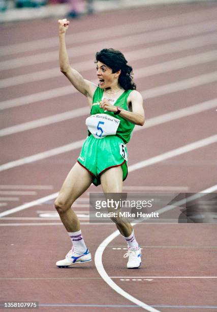 Hassiba Boulmerka of Algeria raises her arms in celebration after winning the Women's 1500 metres event on 6th August 1992 during the XXV Summer...