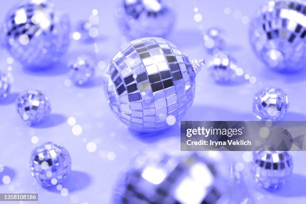 silver disco balls in trendy color of the  year 2022 very peri purple violet. merry christmas, happy new year invitation. - silver disco ball stock pictures, royalty-free photos & images