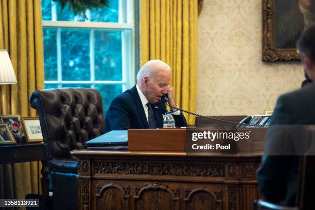 President Joe Biden talks on the phone with Ukrainian President Volodymyr Zelensky from the Oval Office at the White House on December 09, 2021 in...