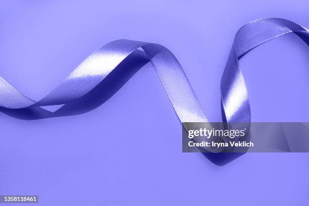 holiday background made from curly satin ribbon in trendy color of the year 2022 very peri  purple violet. - birthday template picture stock pictures, royalty-free photos & images