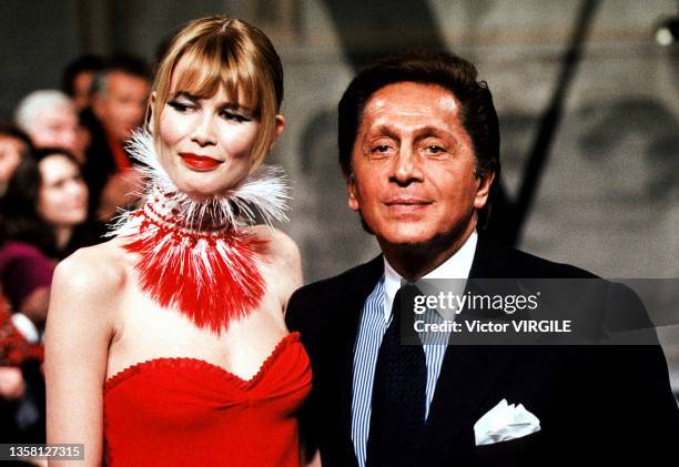 Claudia Schiffer and fashion designer Valentino Garavani walk the runway during the Valentino Haute Couture Spring/Summer 1998 fashion show as part...