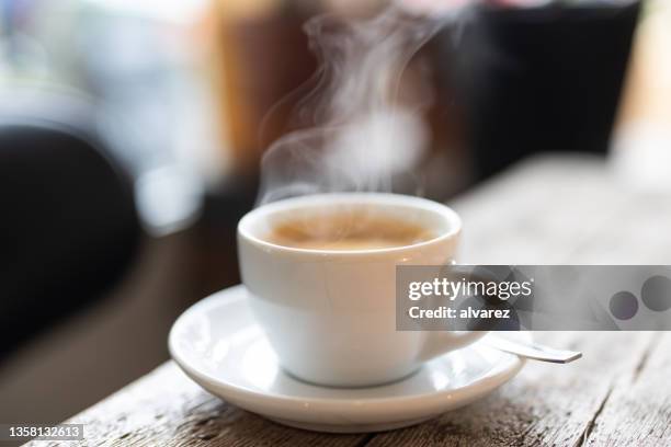 refreshing hot cup of coffee at a cafe - breakfast table stock pictures, royalty-free photos & images