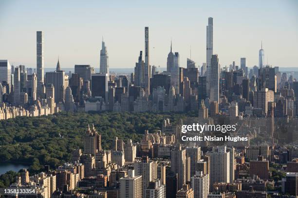 aerial photo of skyscrapers that surround central park in manhattan, new york - central park manhattan fotografías e imágenes de stock