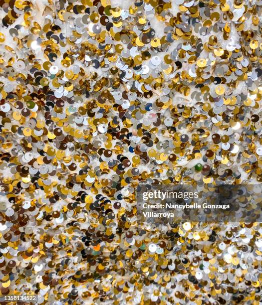black, white, and gold coloured sequins on a fabric - silver sequins stock pictures, royalty-free photos & images