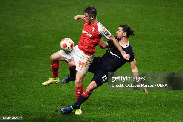 Vitor Oliveira of Sporting Braga is tackled by Aleksandar Dragovic of Crvena Zvezda during the UEFA Europa League group F match between Sporting...