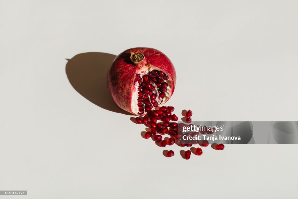 Ut pomegranate on a white background. Menstruation concept. Symbol of vagina. Gynecology, female intimate health