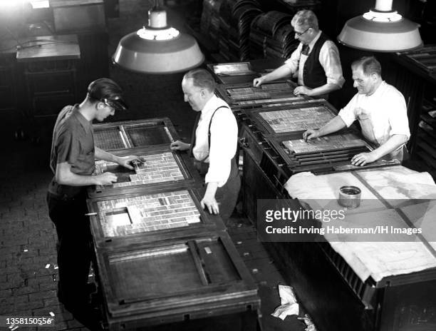 Brooklyn Eagle newspaper editors put together graphics for the next day paper circa 1936 in Brooklyn, New York. The Brooklyn Eagle was a daily...