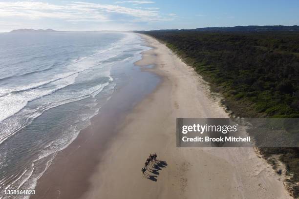 An aerial view of Sophie Matterson and her five camels arrive to greet supporters on the beach at Byron Bay on December 10, 2021 in Byron Bay,...