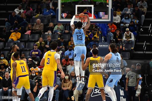 Jaren Jackson Jr. #13 of the Memphis Grizzlies dunks during the first half against the Los Angeles Lakers at FedExForum on December 09, 2021 in...