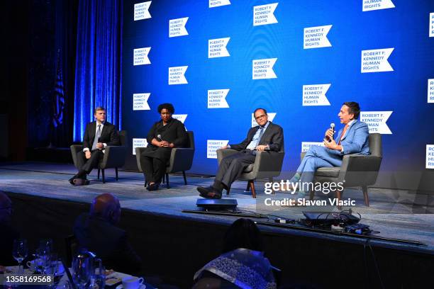 Douglas Brinkley, Stacey Abrams, Deven Parekh and José E. Feliciano speak onstage duringthe 2021 Robert F. Kennedy Human Rights Ripple of Hope Award...