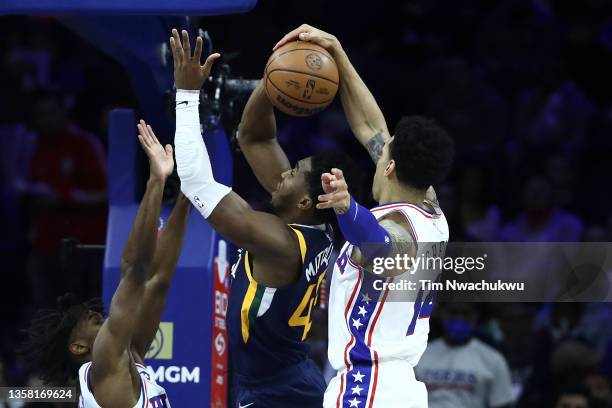 Danny Green of the Philadelphia 76ers blocks Donovan Mitchell of the Utah Jazz during the second quarter at Wells Fargo Center on December 09, 2021...