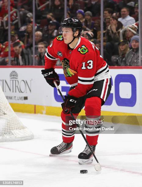 Henrik Borgstrom of the Chicago Blackhawks looks to pass against the New York Rangers at the United Center on December 07, 2021 in Chicago, Illinois....