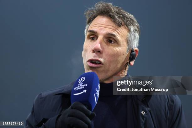 Former Cagliari, Chelsea and Italy footballer Gianfranco Zola reacts as he commentates for Amazon Prime during the UEFA Champions League group F...