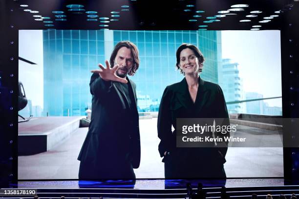 Keanu Reeves and Carrie-Anne Moss speak onscreen during The Game Awards 2021 at Microsoft Theater on December 09, 2021 in Los Angeles, California.