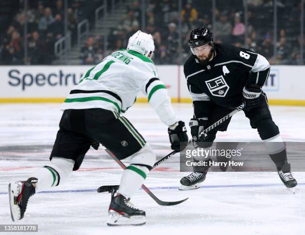 Drew Doughty of the Los Angeles Kings plays the puck at the point in front of Luke Glendening of the Dallas Stars during the second period at Staples...