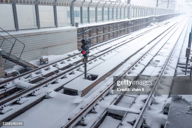 railway track after snow - traffic light empty road stock pictures, royalty-free photos & images