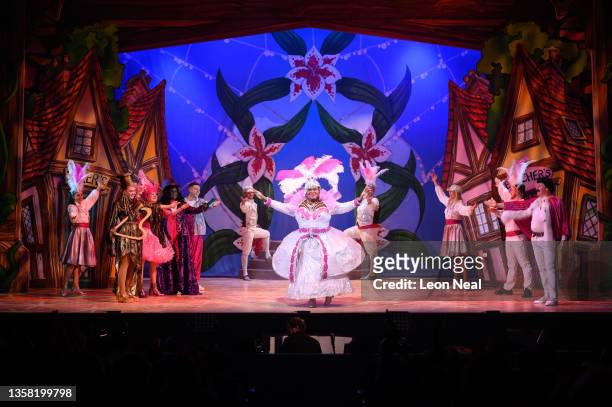 Dame Trot", played by Clive Rowe, receives applause following an evening performance of "Jack and The Beanstalk" pantomime at the Hackney Empire on...