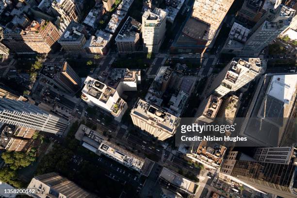 aerial photo looking directly down on the skyscrapers in midtown manhattan, new york - broadway street stock pictures, royalty-free photos & images
