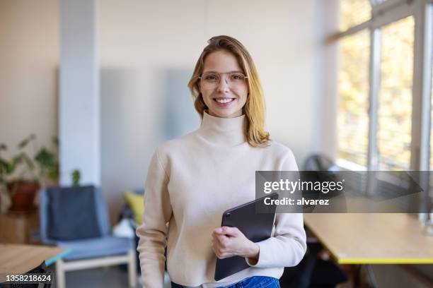 portrait of a young successful businesswoman at startup company - portrait of cool creative businesswoman at office bildbanksfoton och bilder