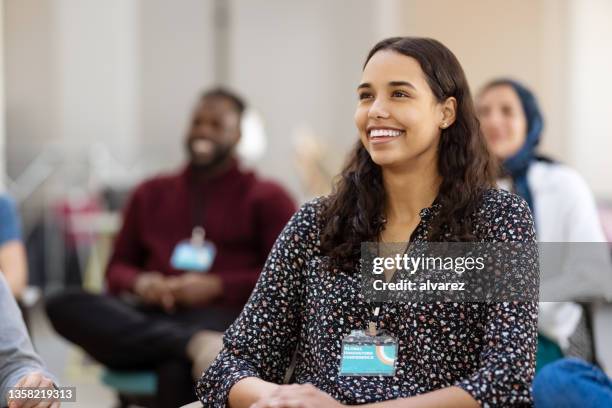 audience smiling during a seminar - attendance imagens e fotografias de stock