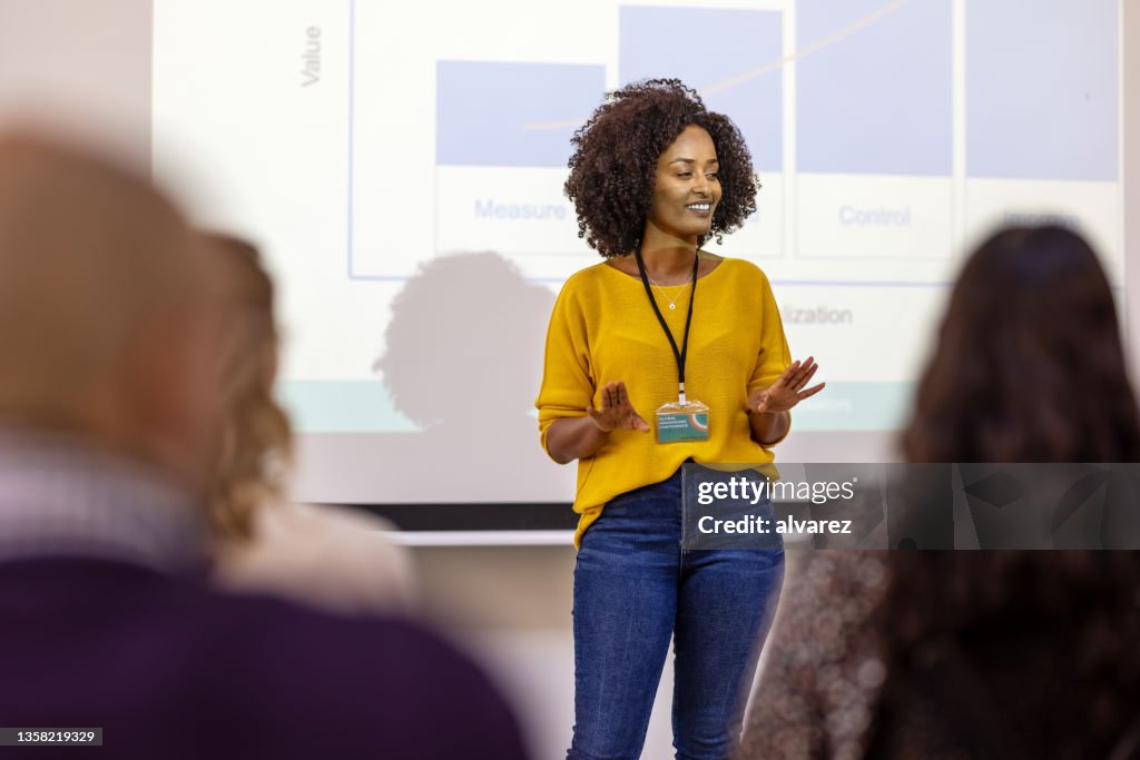 Woman entrepreneur presenting at business seminar