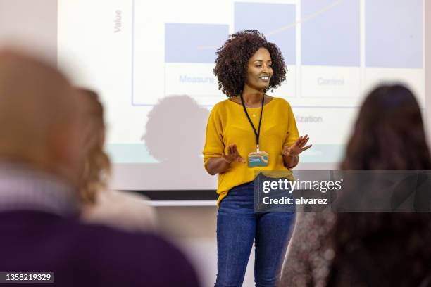 woman entrepreneur presenting at business seminar - presentation stock pictures, royalty-free photos & images