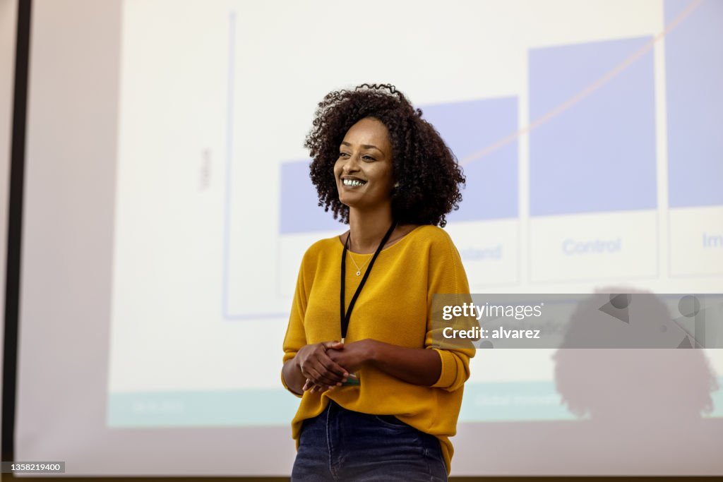 Woman entrepreneur presenting her ideas during a seminar