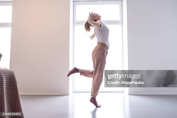 woman relaxing at home - the feldenkrais method - dancing feet stock pictures, royalty-free photos & images