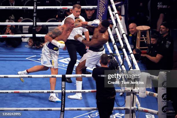 Oleksandr Usyk attacks Anthony Joshua late in the final round in their World Heavyweight title boxing fight at the Tottenham Hotspur Stadium on...