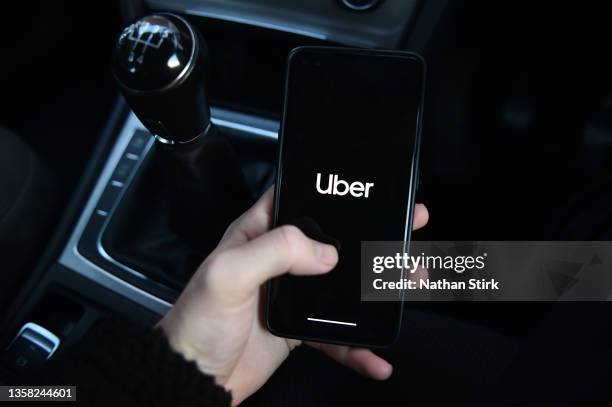 Phone is held displaying the Uber app on December 10, 2021 in Stoke on Trent, England.