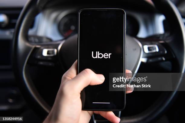 Phone is held displaying the Uber app on December 10, 2021 in Stoke on Trent, England.