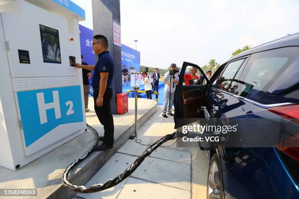 Haima 7X 70MPa hydrogen fuel cell MPV is charged at Haima Automobile's first hydrogen refueling station on December 10, 2021 in Haikou, Hainan...