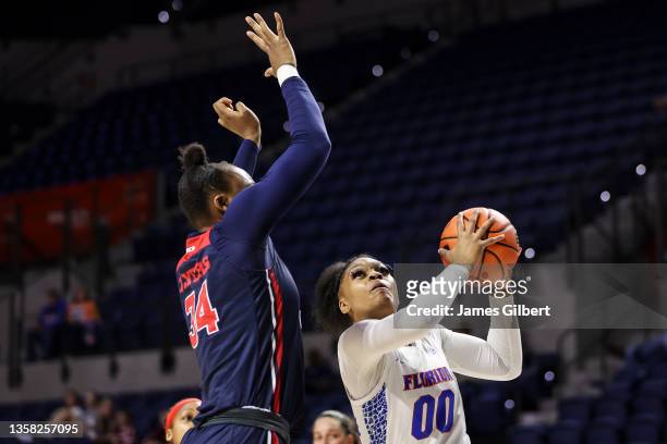 Taliyah Wyche of the Florida Gators drives to the basket against Tenin Magassa of the Dayton Flyers during the first half of a game at the Stephen C....