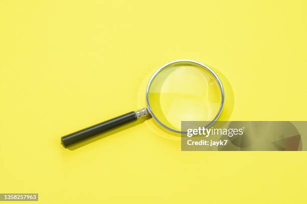 magnifying glass - vergrößerungsglas stock-fotos und bilder