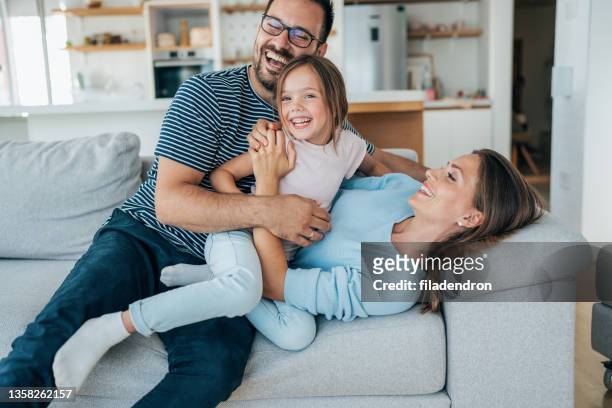 family fun - family at home stock pictures, royalty-free photos & images