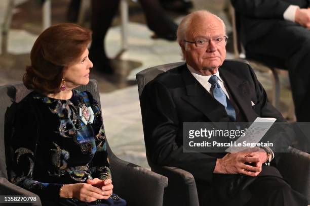 Queen Silvia of Sweden and King Carl XVI Gustaf of Sweden are seen during the Nobel Prize Awards ceremony at the Concert Hall on December 10, 2021 in...