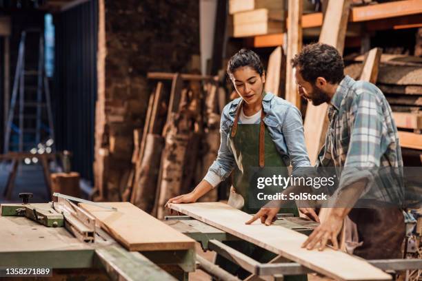 discussing what's best - carpentry tools stockfoto's en -beelden