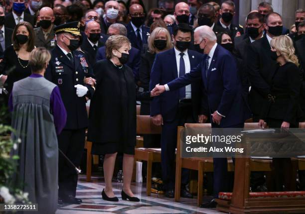 President Joe Biden greets Elizabeth Dole at the funeral service for her husband former Senator Robert Dole at Washington National Cathedral on...