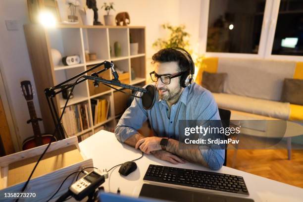 modern handsome man during his podcast talking about some interesting topics - male journalist stock pictures, royalty-free photos & images